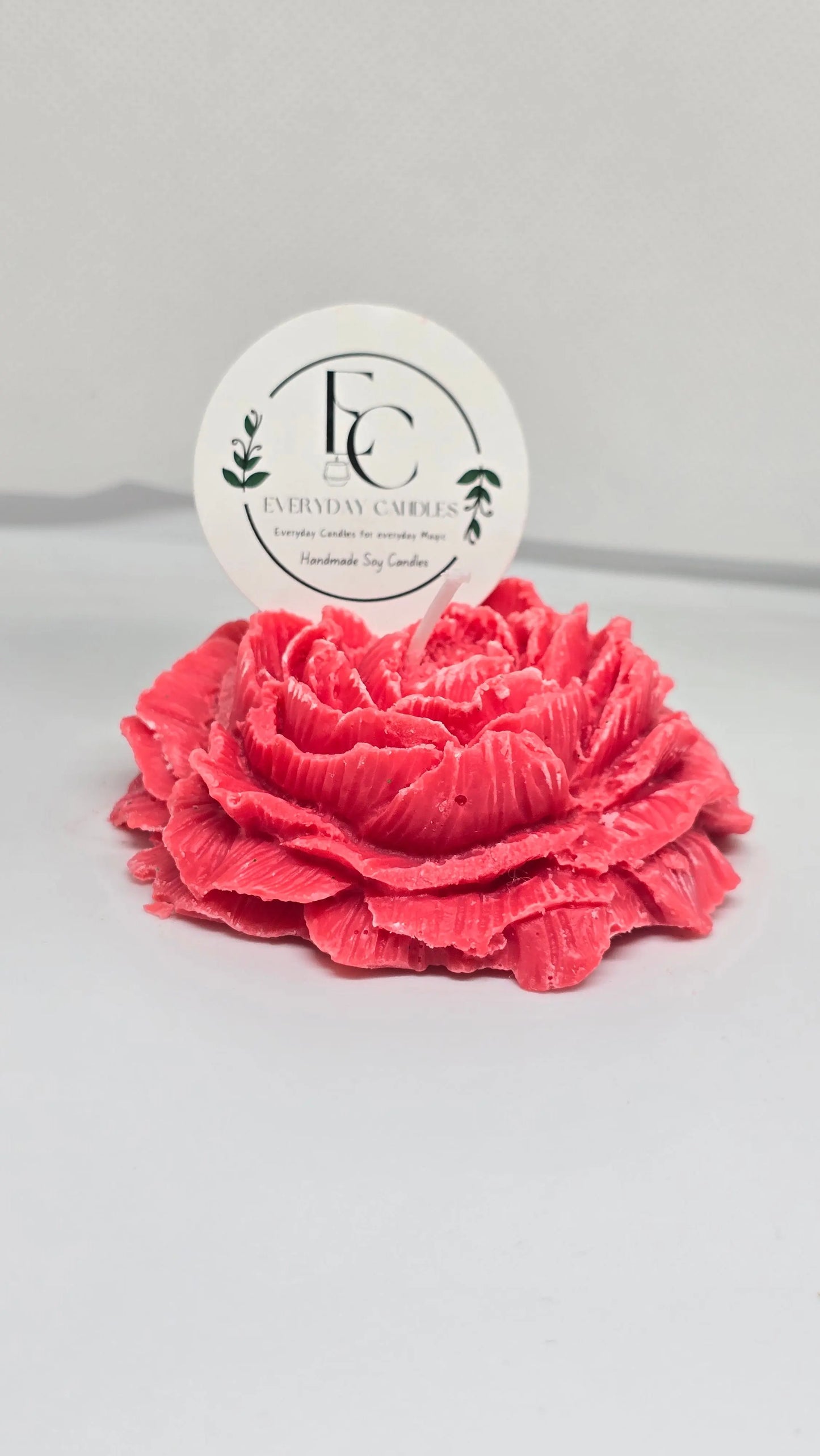 Handmade rose-shaped soy candle in pink, detailed petals, small-batch crafted in BC.