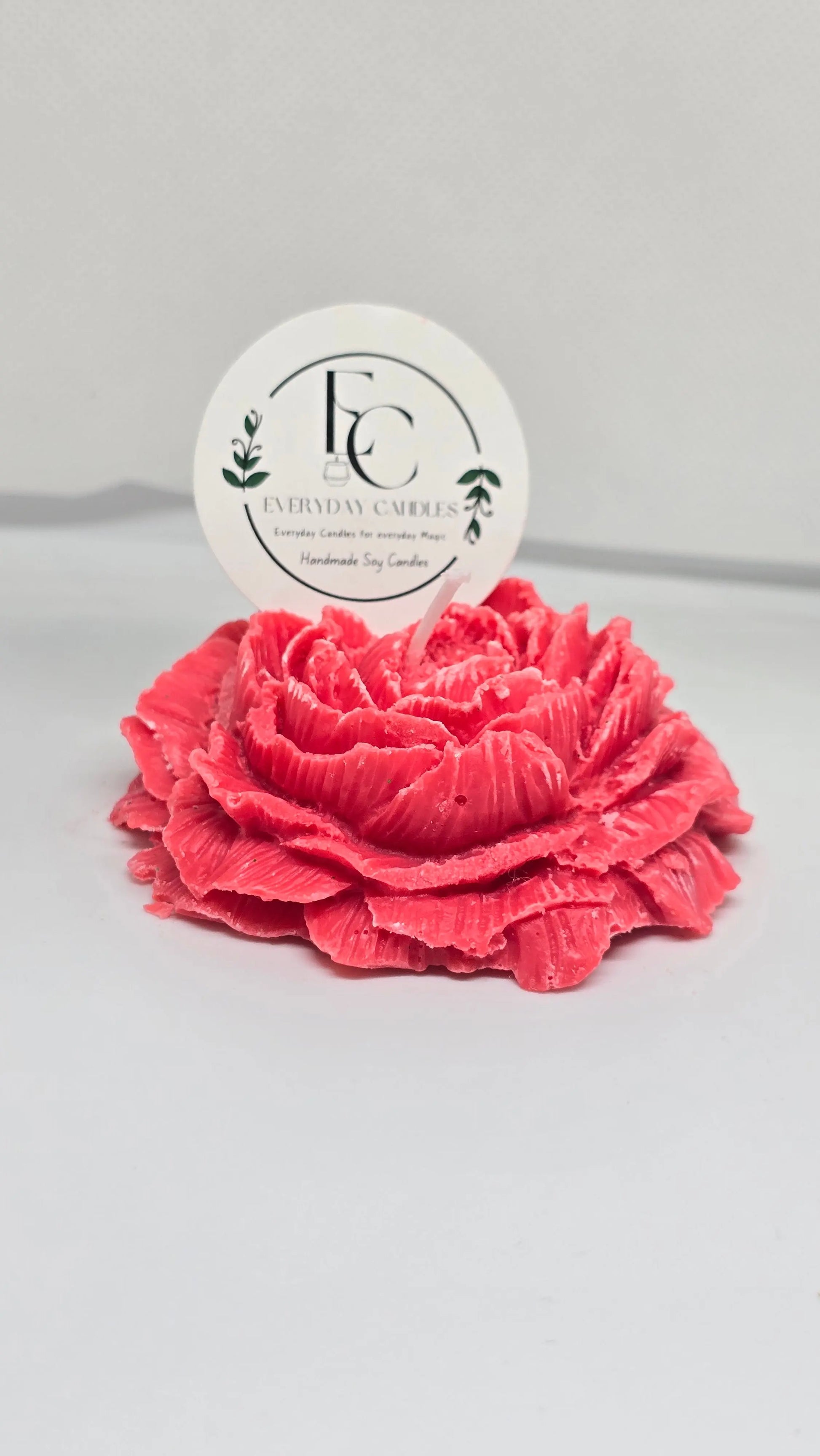Handmade rose-shaped soy candle in pink, detailed petals, small-batch crafted in BC.