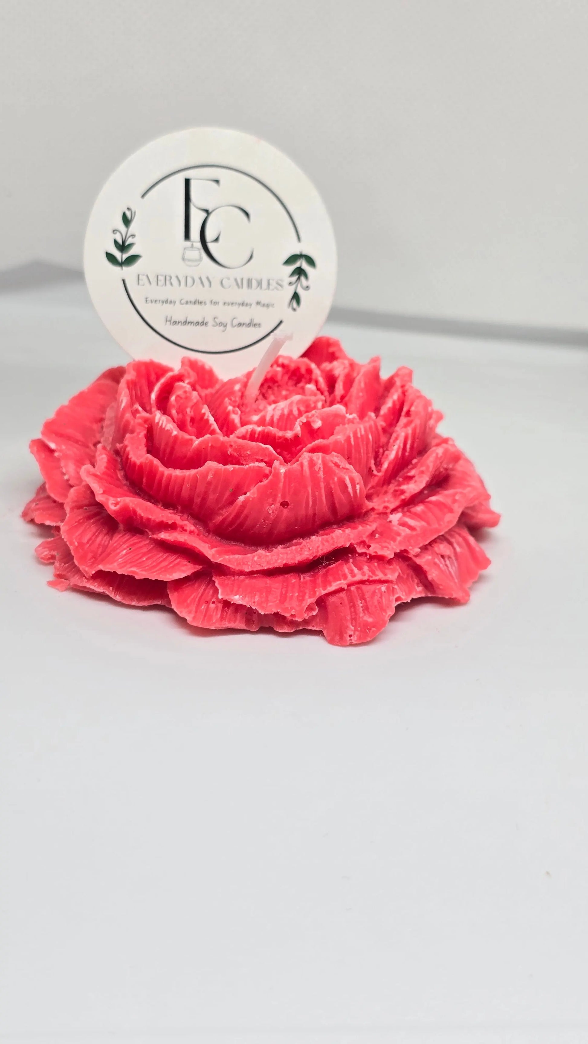 Handmade rose-shaped soy candle in pink, detailed petals, small-batch crafted in BC.