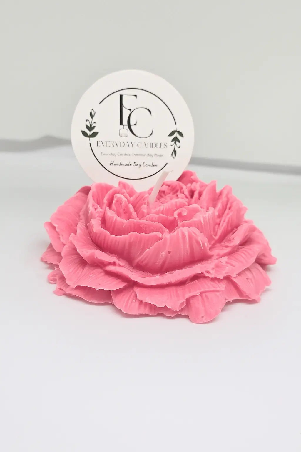 Handmade rose-shaped soy candle in pink, detailed petals, small-batch crafted in BC.