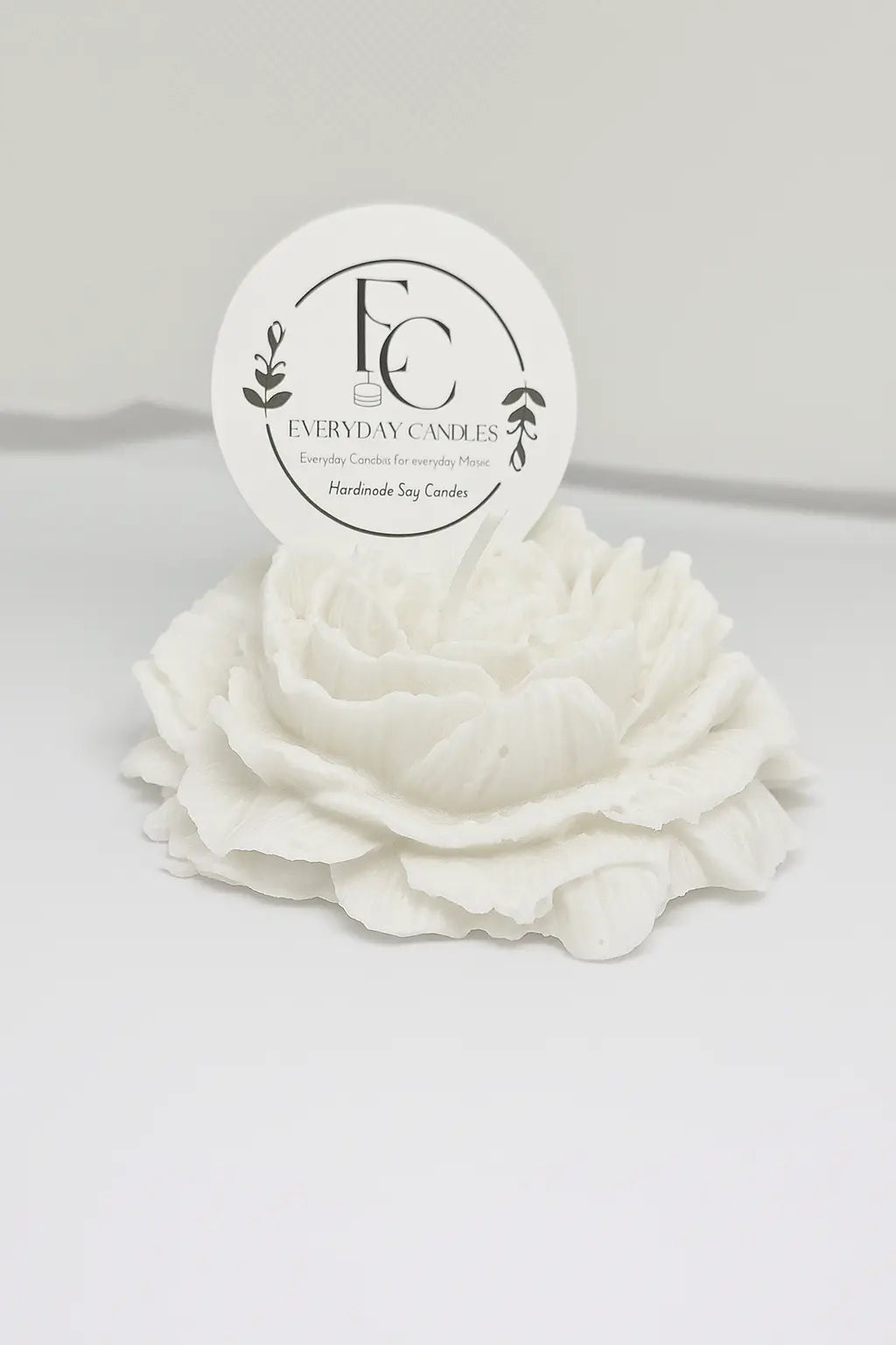Handmade rose-shaped soy candle in white, detailed petals, small-batch crafted in BC.
